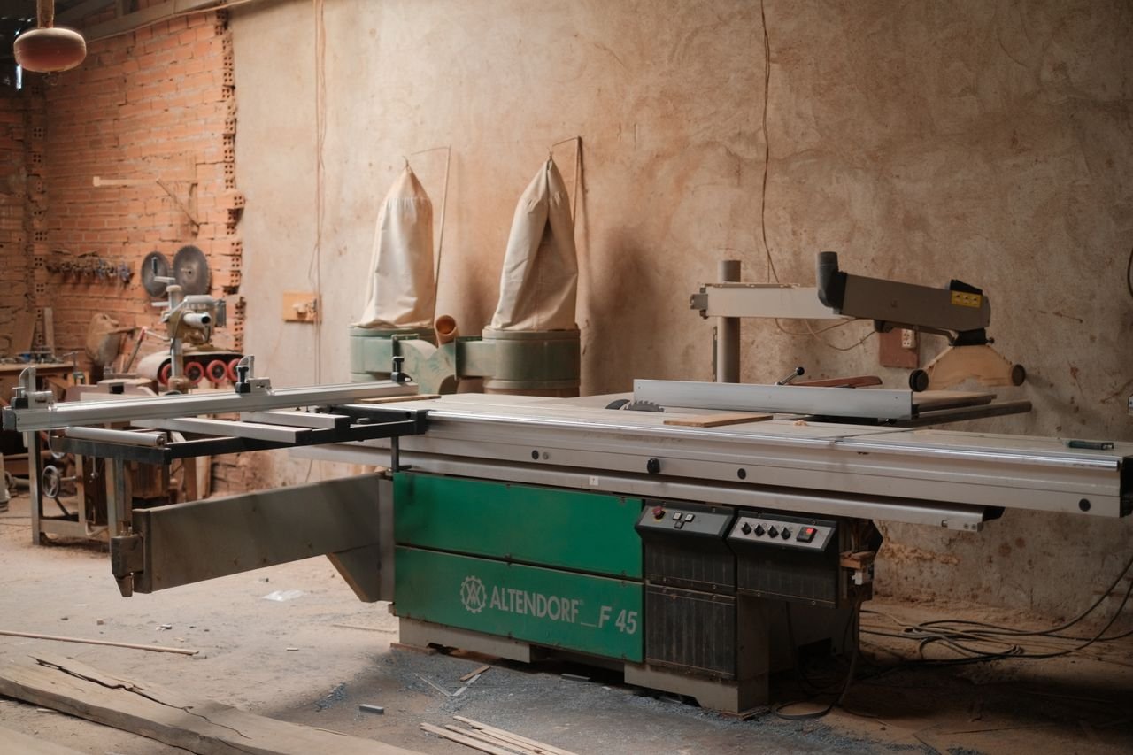 Cozy woodworking workshop featuring a professional Altendorf F45 sliding table saw.